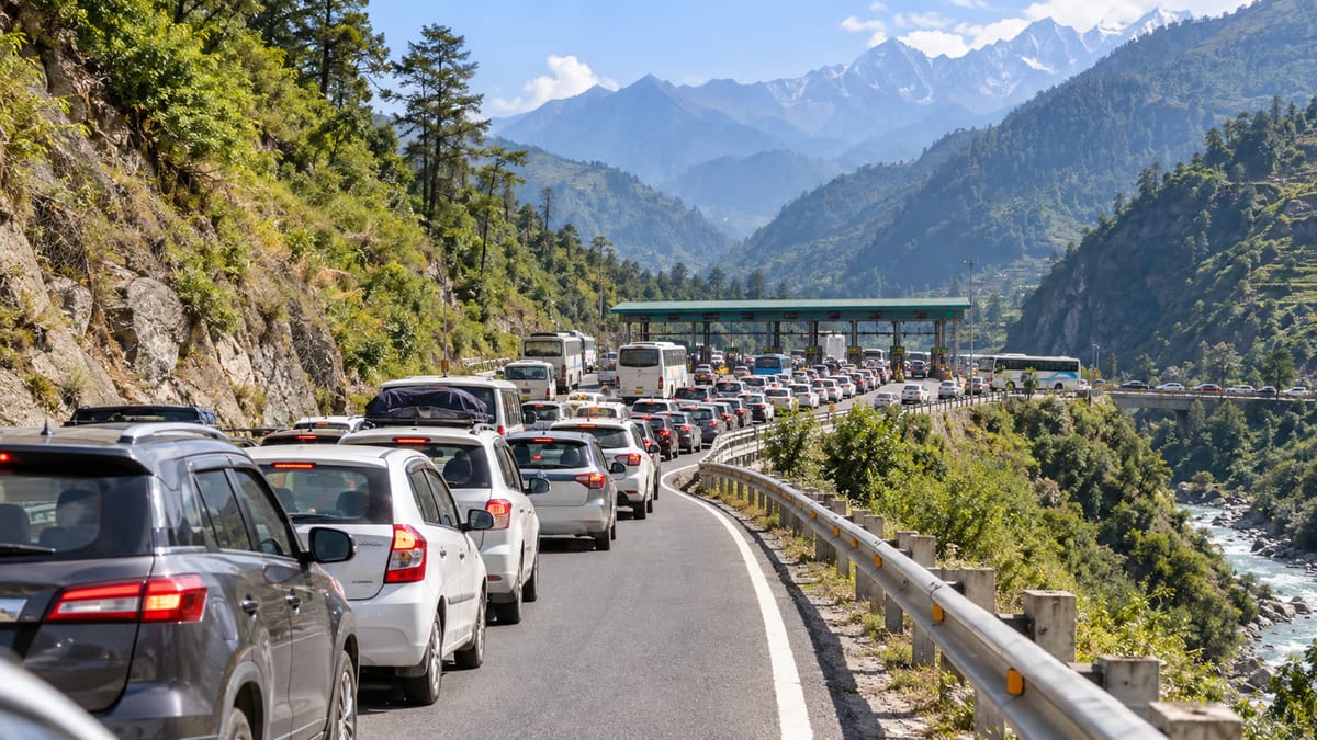 Illustrative view of a long queue of cars and buses approaching a toll plaza on a Himalayan mountain highway